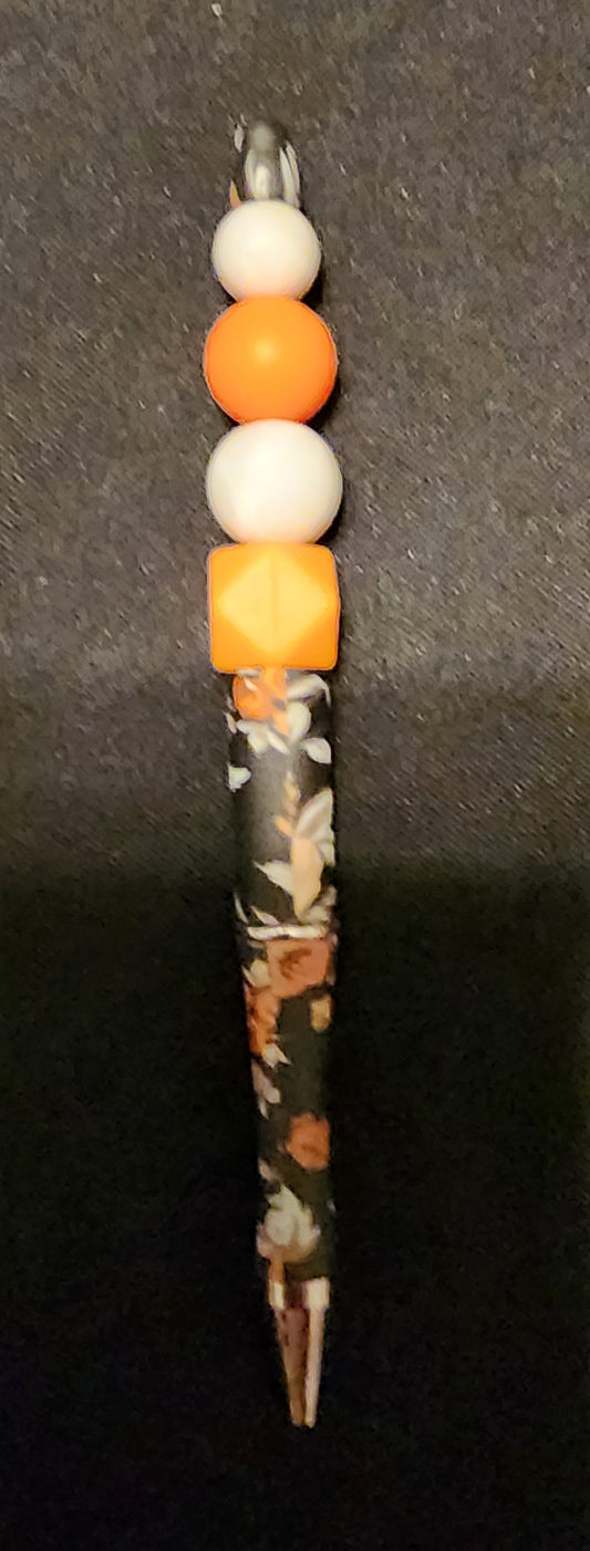 Black and orange floral print pen